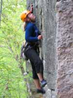 Katie making a big move. (Category:  Rock Climbing)