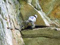 Ryan starting the crux of Inverted Layback. (Category:  Rock Climbing)