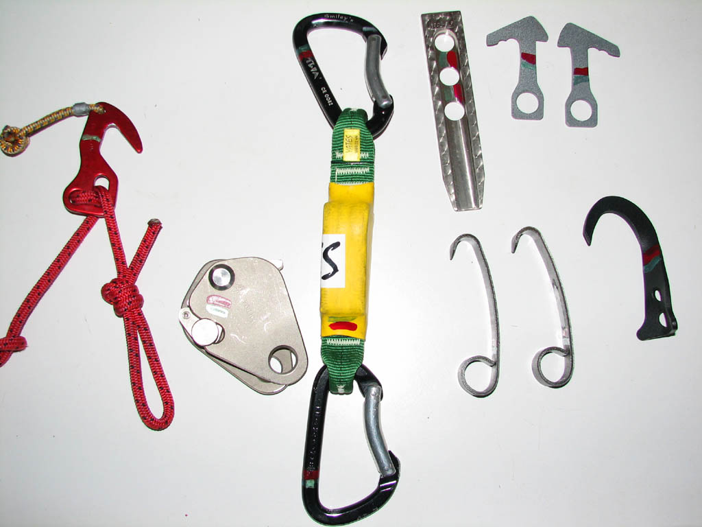 Some of my aid gear.  Adjustable fifi, Ushba basic ascender, shorty screamer, titanium piton, pika auk hooks, stubai cliffhanger hooks, pika ibis hook. (Category:  Rock Climbing)