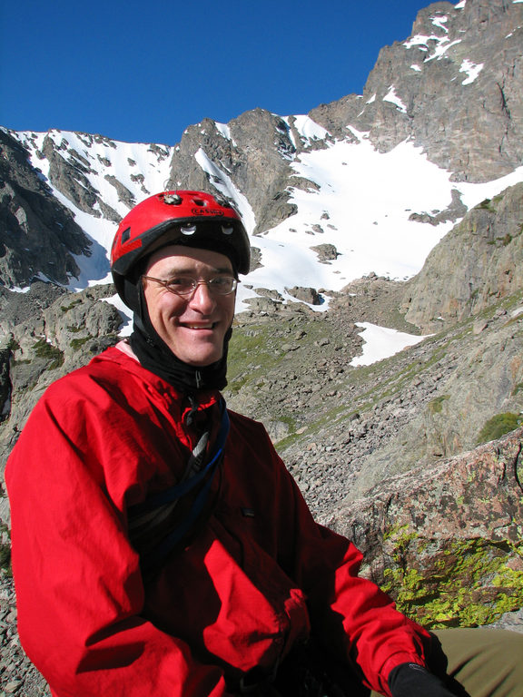 Sitting on a ledge on Petit Grepon with Taylor Peak in the background. (Category:  Rock Climbing)