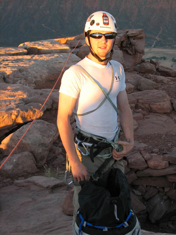 Ryan packing the haul bag on the summit of Castleton. (Category:  Rock Climbing)