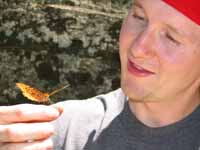 Ryan with a very friendly butterfly. (Category:  Rock Climbing)