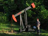 Ryan near one of the oil wells we saw in the woods. (Category:  Rock Climbing)