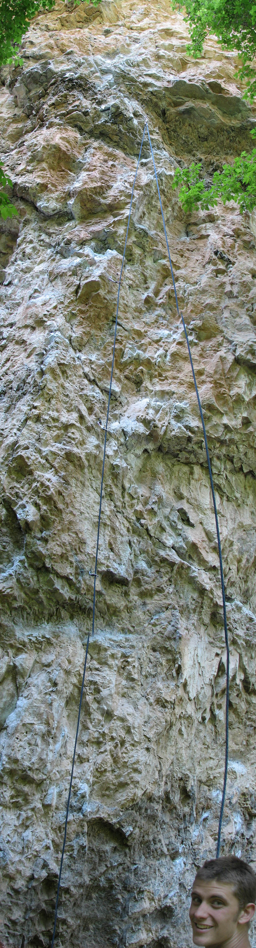 Alex at the bottom of a panorama of Choss Family Robinson. (Category:  Rock Climbing)