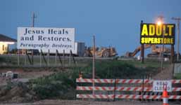 We thought these signs were particularly funny.  We didn't see any anti-evolution billboards, but I suspect they exist somewhere in Kansas. (Category:  Rock Climbing)