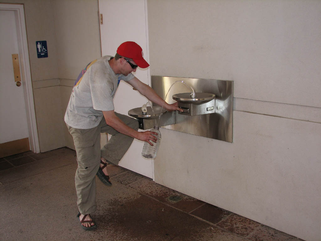 Ryan's creative method of filling water jugs as quickly as possible. (Category:  Rock Climbing)