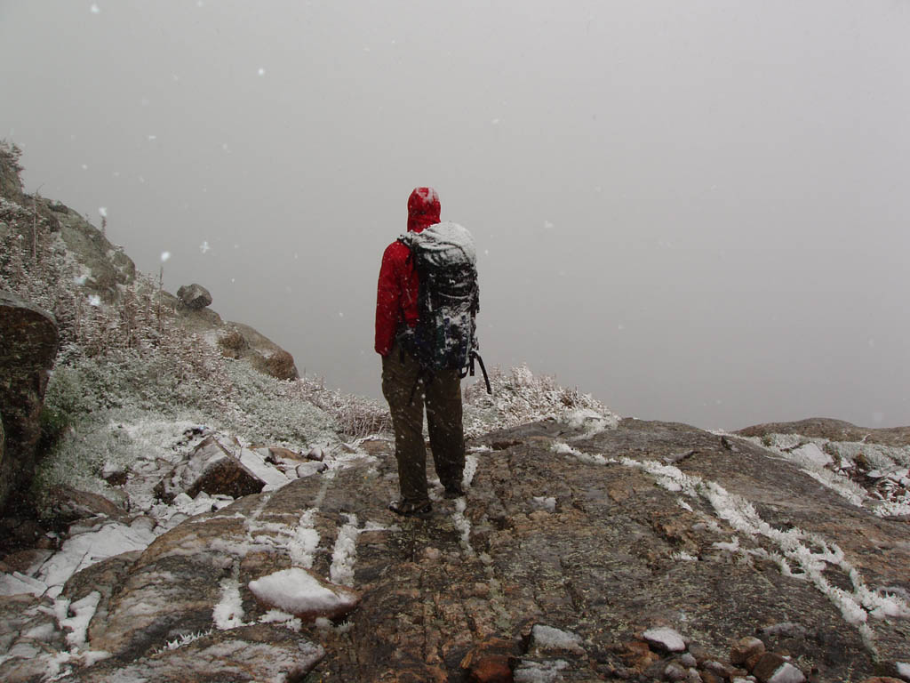 In the blizzard at the base of Petit Grepon. (Category:  Rock Climbing)
