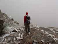 In the blizzard at the base of Petit Grepon. (Category:  Rock Climbing)