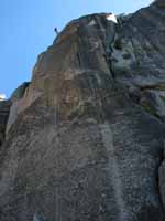 Jess starting to rappel down to the base of the spire as seen from my vantage at the base. (Category:  Rock Climbing)