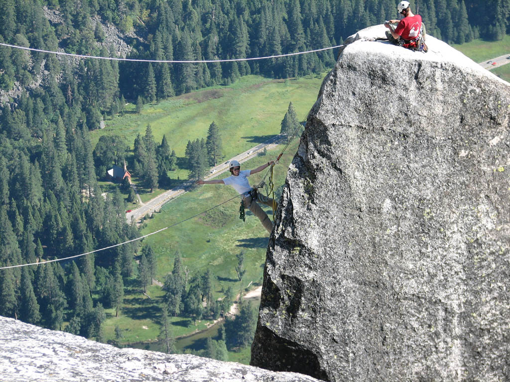 Jess starting the tyrolean from Lost Arrow Spire to the north rim. (Category:  Rock Climbing)