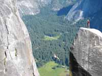 Jess doing the tyrolean from Lost Arrow Spire to the north rim. (Category:  Rock Climbing)
