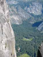 Jess doing the tyrolean from Lost Arrow Spire to the north rim. (Category:  Rock Climbing)