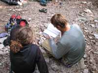 Lauren and Greg checking out a guidebook. (Category:  Rock Climbing)