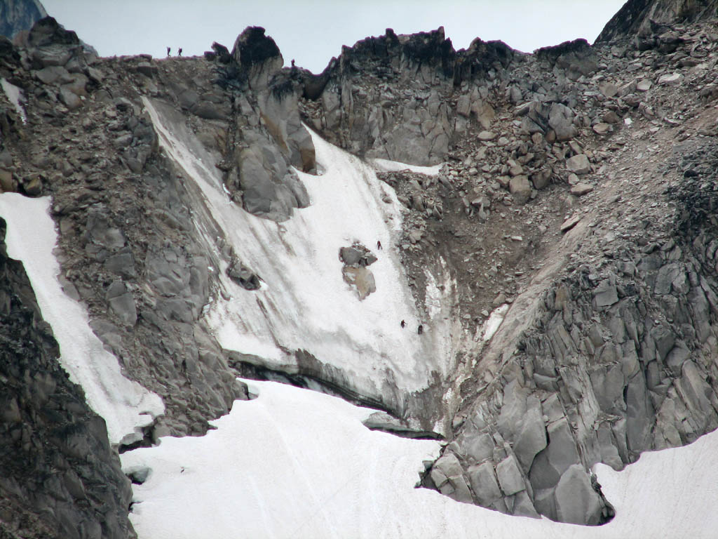 The top 500' of the Bugaboo-Snowpatch col.  Climbers are visible above the bergschrund. (Category:  Rock Climbing)