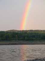 Driving home I saw the brightest rainbow I've ever seen in my life.  It was bright enough to reflect off the lake. (Category:  Family)