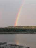 Driving home I saw the brightest rainbow I've ever seen in my life.  It was bright enough to reflect off the lake. (Category:  Family)