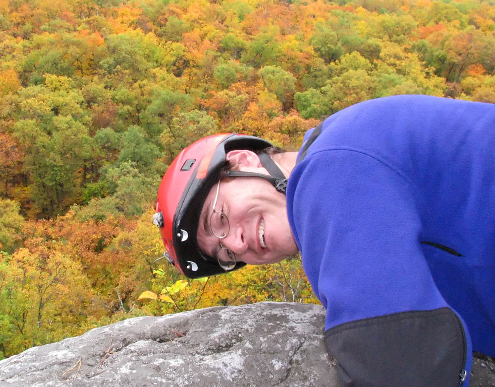 At the top of Disneyland.  Fall colors vibrant in the background. (Category:  Rock Climbing)