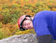 At the top of Disneyland.  Fall colors vibrant in the background. (Category:  Rock Climbing)