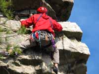 Leading the traverse on the direct variation to the third pitch of Thin Slabs. (Category:  Rock Climbing)