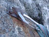 Yes, I really clipped this broken 40-year-old homemade hanger on a rusted quarter inch bolt. (Category:  Rock Climbing)