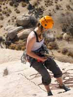 Kristin rappelling off Mike's Books, Intersection Rock. (Category:  Rock Climbing)