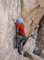 Kenny on the hard opening moves of The Kid, Saddle Rock. (Category:  Rock Climbing)