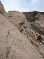 Kristin at the first rappel station descending from Walk on the Wild Side. (Category:  Rock Climbing)