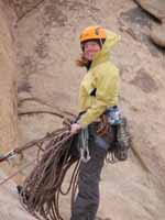 Kristin at the first rappel station descending from Walk on the Wild Side. (Category:  Rock Climbing)