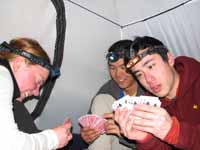 Kristin, Aramy and Kenny playing cards in my tent. (Category:  Rock Climbing)