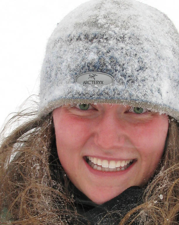 Anna's hat is covered in snow because after a particularly intense wipe out, her head was completely submerged in the snow. (Category:  Skiing)