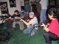 Felicia, me, Anna and Amanda shooting M-16s. (Category:  Party)