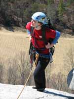 Anna reaching the top of The Great Arch. (Category:  Rock Climbing)