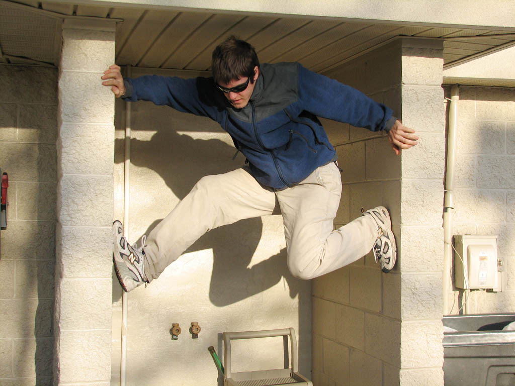 Kyle climbing the gas station. (Category:  Rock Climbing)