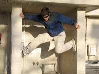 Kyle climbing the gas station. (Category:  Rock Climbing)