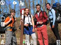 Floris, Julia, me and Heather posing by a Finger Lakes Trail marker.  I created this image with Photoshop to make it look like a camera's viewfinder. (Category:  Backpacking)