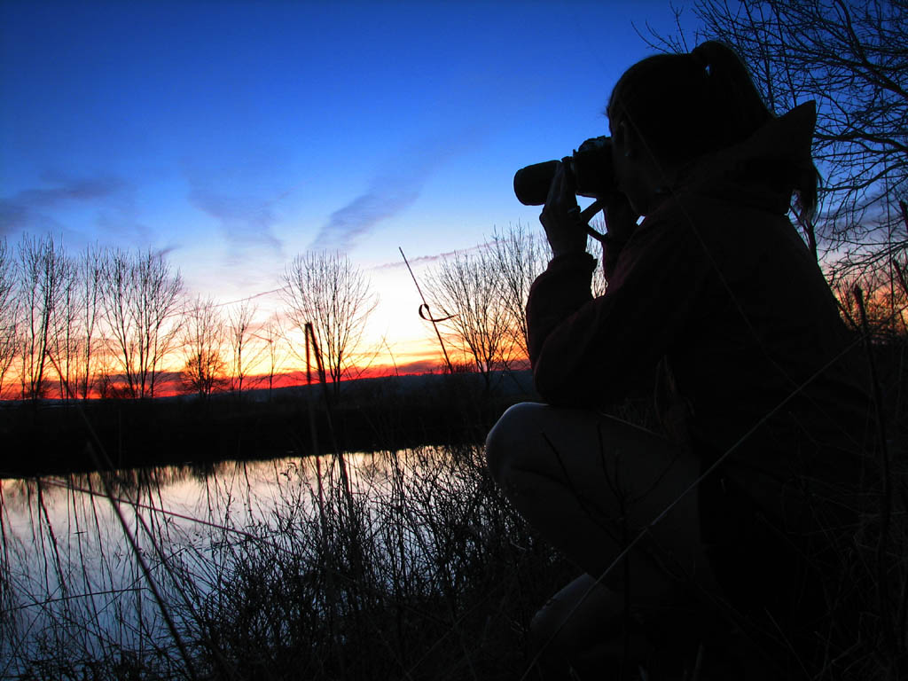 Heather taking a sunset picture. (Category:  Backpacking)