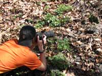 Floris getting a picture of a snake. (Category:  Backpacking)