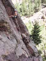 Margo finishing the rappel from the top of Wind Tower. (Category:  Rock Climbing)