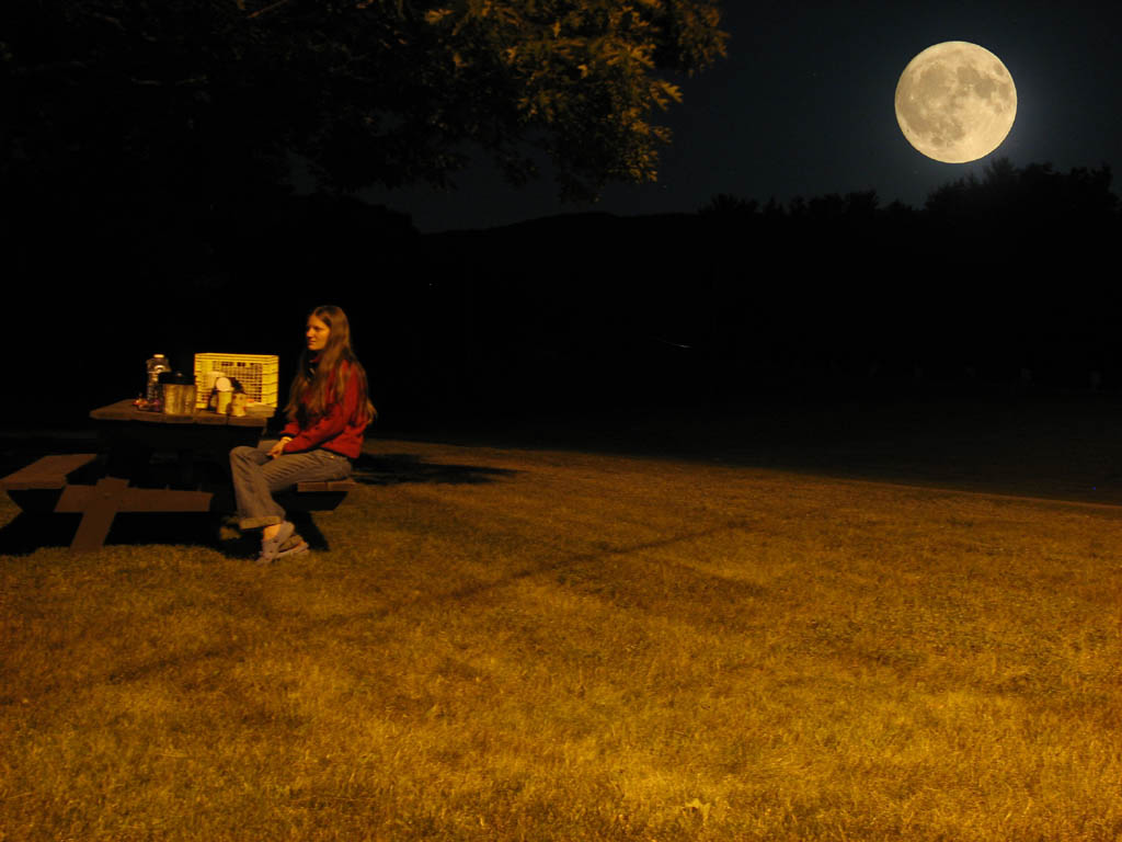 Anna eating dinner at the rest area.  The full moon was much brighter than the foreground, so this is two (Category:  Rock Climbing)