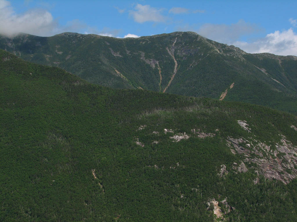 The clouds finally break as we reach the top. (Category:  Rock Climbing)