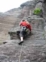 Anna attempting Drilling for Dollars. (Category:  Rock Climbing)