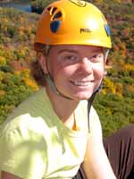 Kristin with fall colors below. (Category:  Rock Climbing)