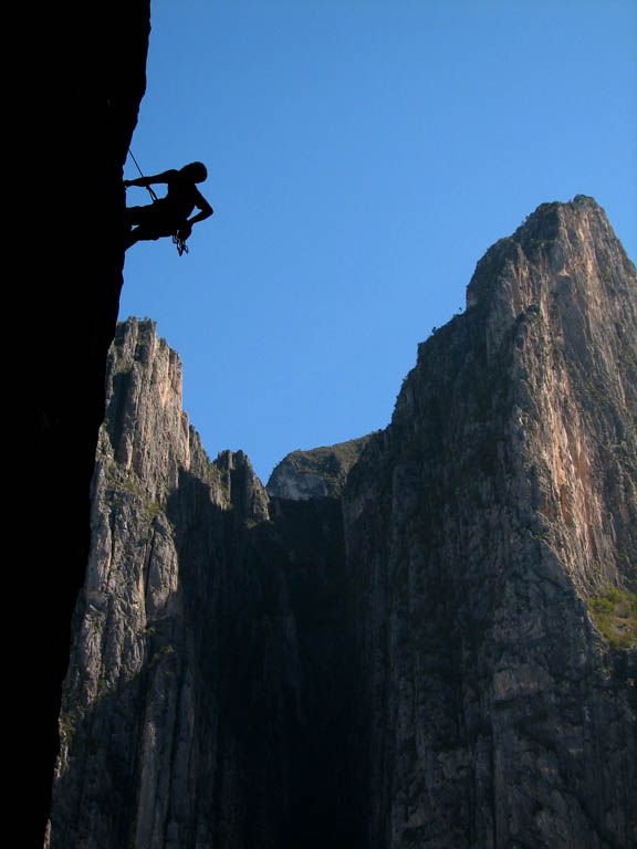 Kenny working the very hard climb. (Category:  Rock Climbing)