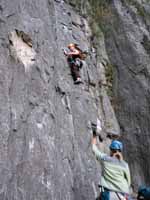 Kristin leading the first pitch (5.11a) of Super Nova. (Category:  Rock Climbing)