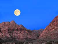 Full moon setting over Oak Creek Canyon early in the morning as Kristin and I start the hike to the base of Black Orpheus. (Category:  Rock Climbing)