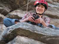 Stretching on a ledge in the middle of the climb. (Category:  Rock Climbing)