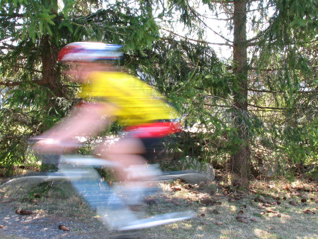 I used second curtain flash sync in an attempt to get a sharp image of Kristin with a blurred trail. (Category:  Biking)