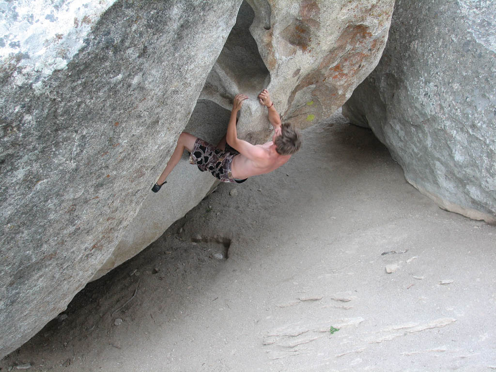 Guy bouldering at the base of Elephant Rock. (Category:  Rock Climbing)