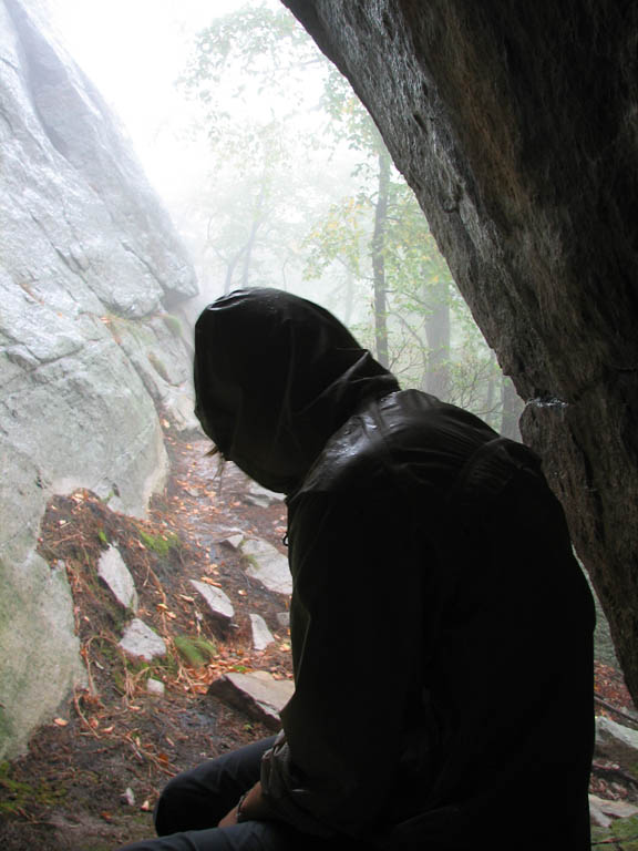 Ducking into a mostly dry cave. (Category:  Rock Climbing)