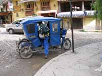 One of the ubiquitous moto-taxis. (Category:  Travel)